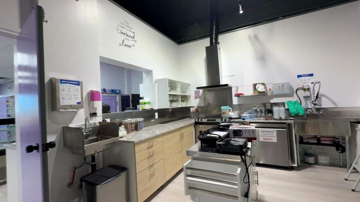 Commercial kitchen with exhaust hood
